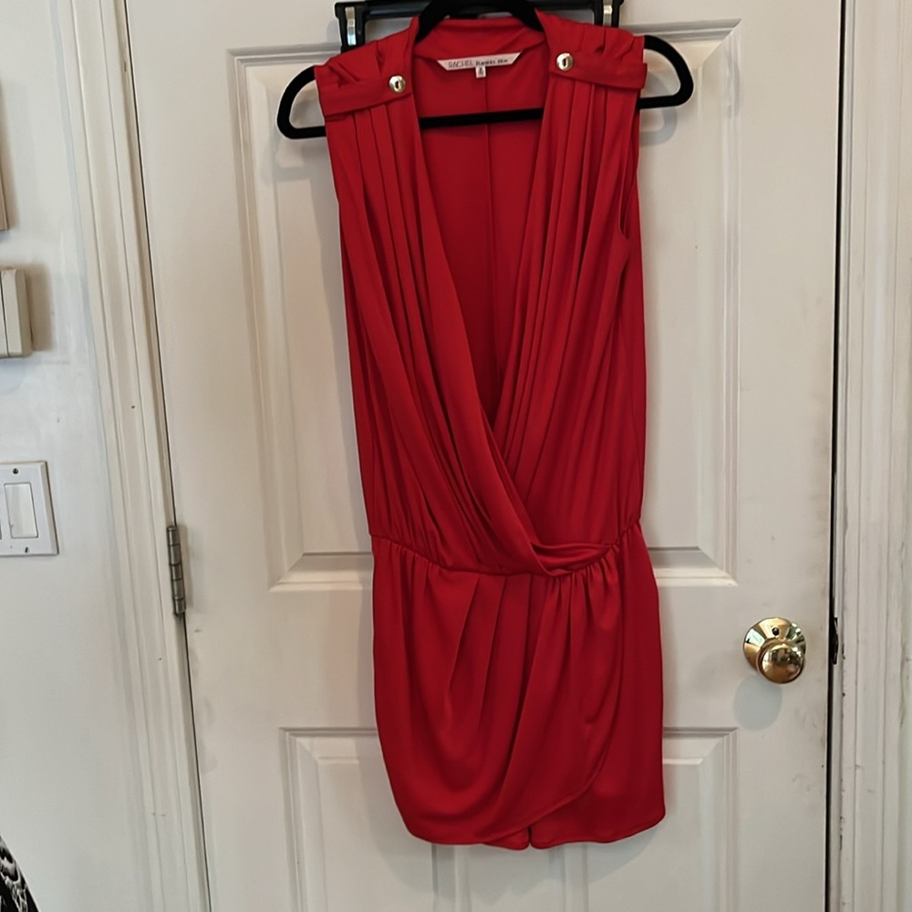 Rachel by Rachel Roy faux wrap , looks like a dress in front with
pockets